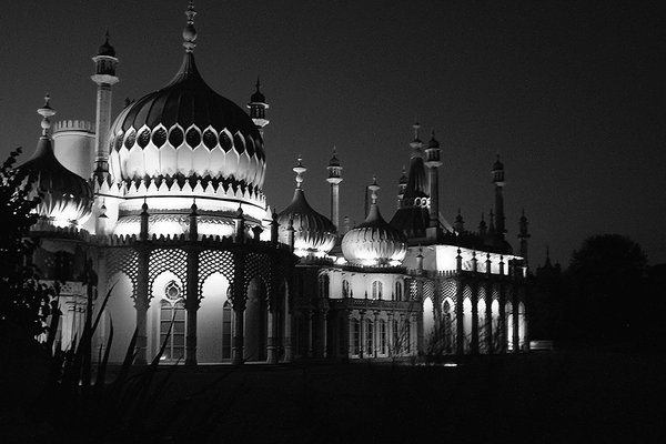A floodlit domed pavilion at night